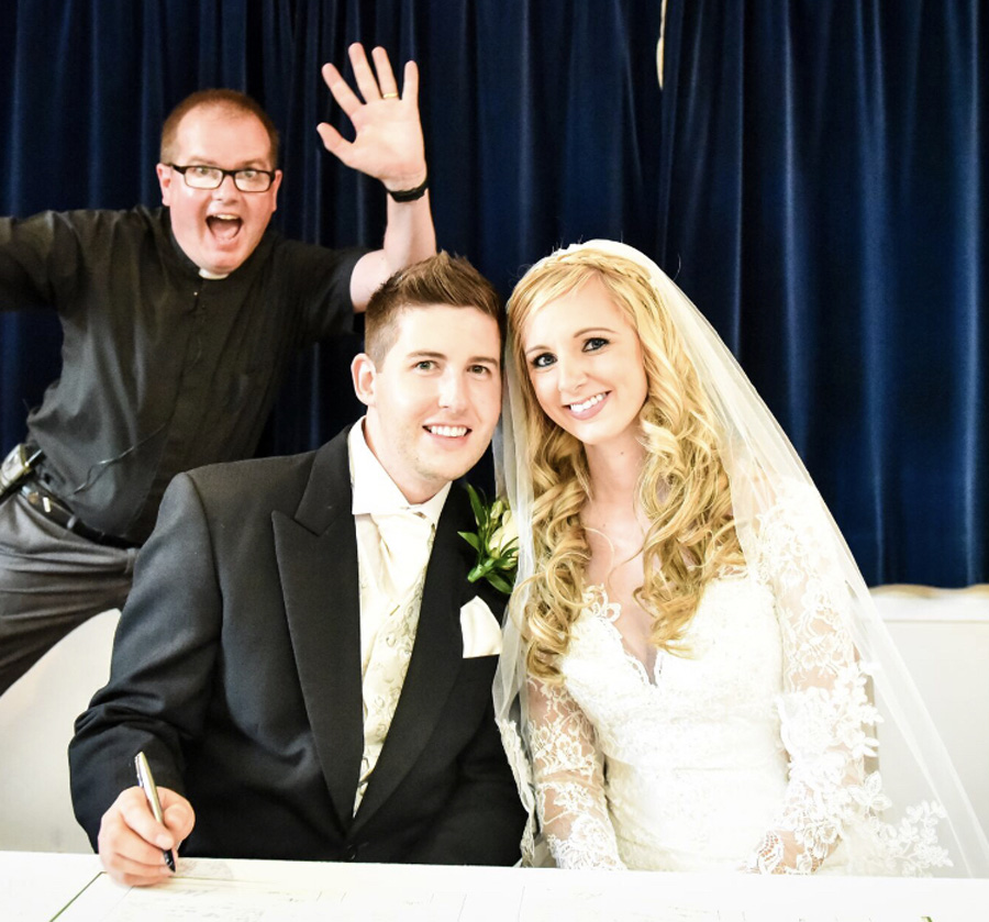 Only our vicar would photo bomb our first photo together as a married couple!