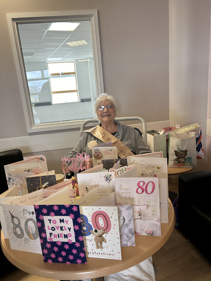 My fabulous mum, celebrating her 80th birthday with a smile despite being ill in hospital